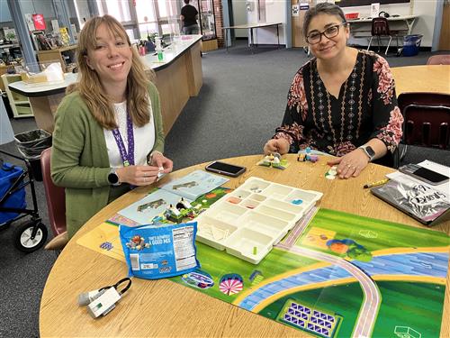 women building LEGO
