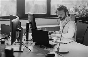 Worker at a desk translating between languages 