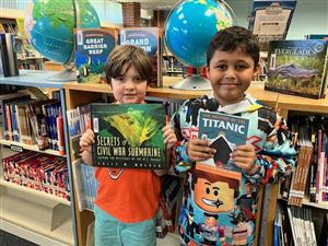 boys holding books