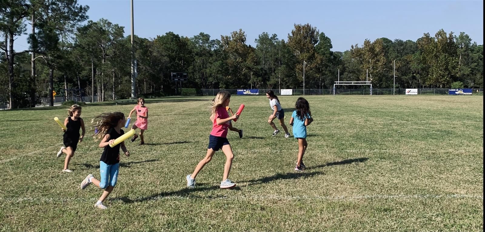 Girls on the Run participants playing socially distanced tag.