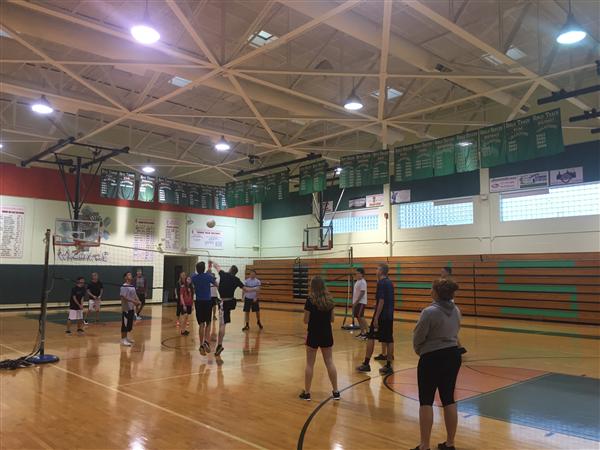 Students were playing volleyball in class. 