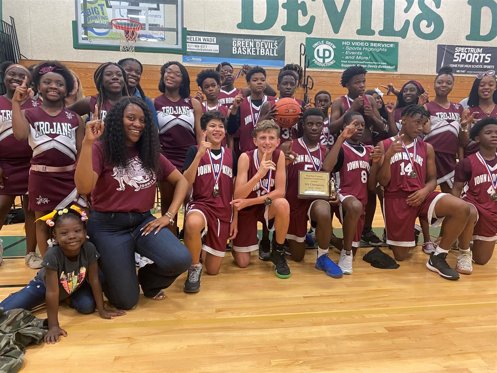  Players and cheerleaders celebrate the victory