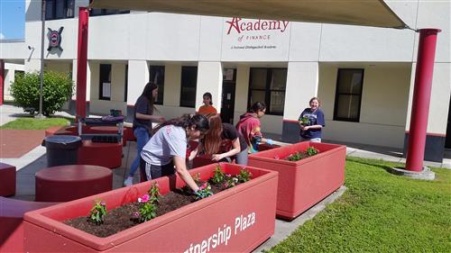 Students planting flowers