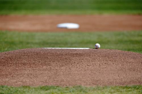 pitchers mound with lone baseball 
