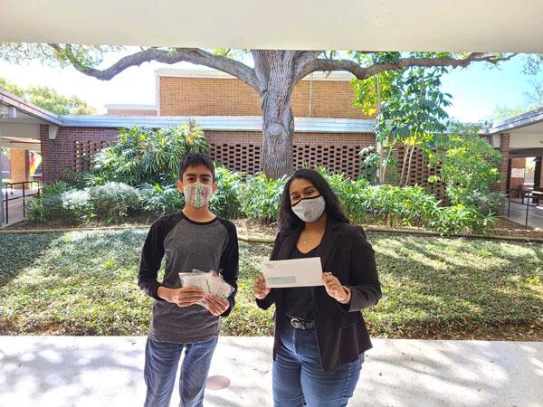 Largo Middle IB World School 7th grader, Ainesh Kumar, presented a donation check to Feeding Tampa Bay.