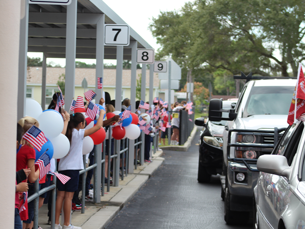 M.K. Rawlings Elementary honored their Veterans with a drive by celebration.