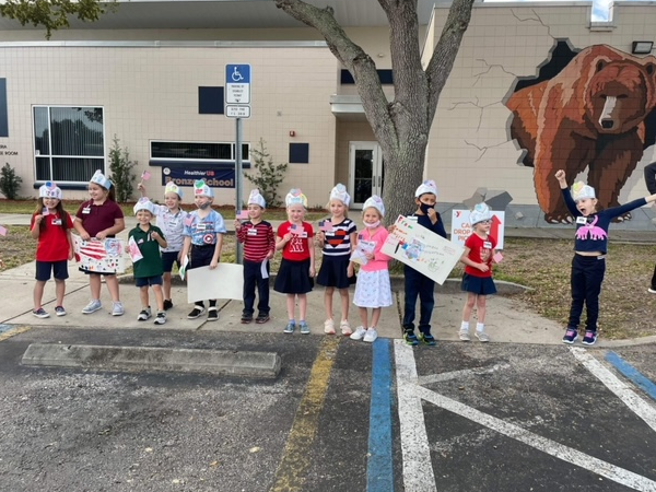 Starkey Elementary students made signs and waved flags to thank Veterans on Veterans Day.