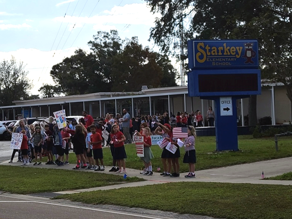 Starkey Elementary Students gathered in front of the school to welcome Veterans to the school for Veterans Day.