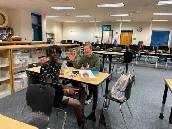 Marvelous mentors meet with their super students at Carwise Middle School. 