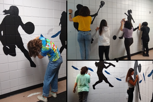 The East Lake High Art Honor Society created a mural representing the female athletes at work at East Lake High School.  