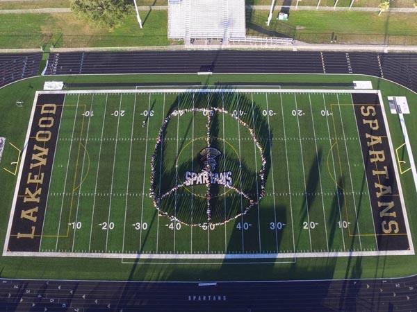 Lakewood High created a large peace symbol during their SAVE/Unity Day celebration.