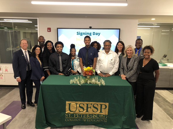 Michael Wright, Tristian Williams and Juan daCosta officially signing on to the program with USF and signing their advance contract committing to become educators in Pinellas County Schools