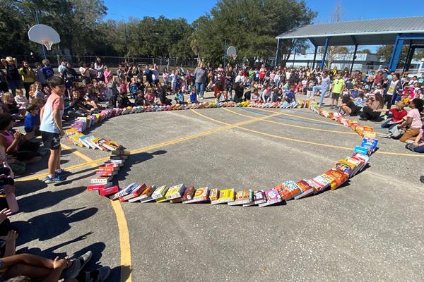 Oldsmar Elementary students gathered around the school courtyard to watch the launch of the “Cereal Box Domino Challenge”. 