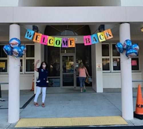 Staff at M.K. Rawlings Elementary welcome students back to school.