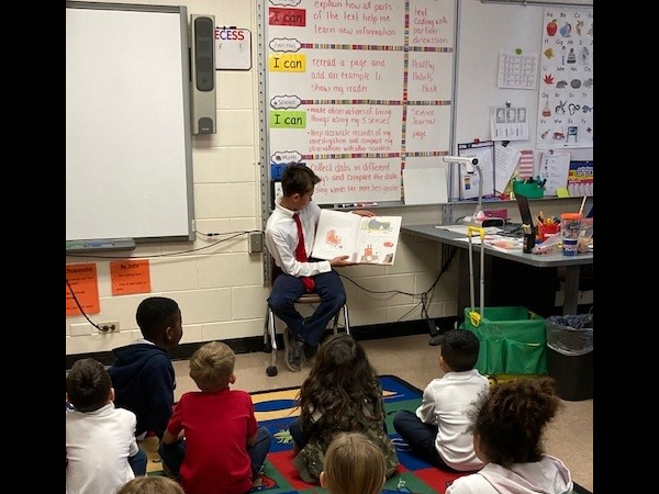 M.K. Rawlings Elementary 5000 Role Model boys read to kindergarten and 1st grade classes.