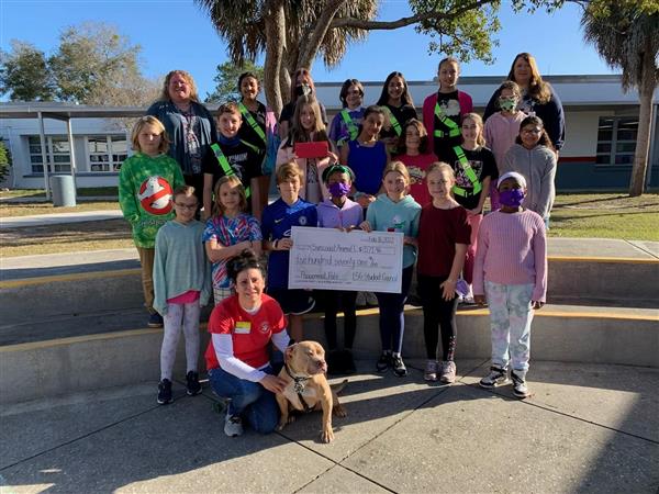 Lake St. George Elementary Student Council presented a check to the Suncoast Animal League. Students were able to donate $571.96!