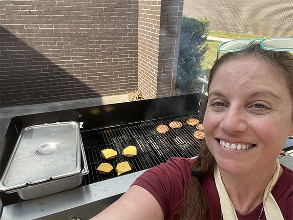 Principal Quinn Williams of Walsingham Elementary cooked burgers for her staff for lunch.