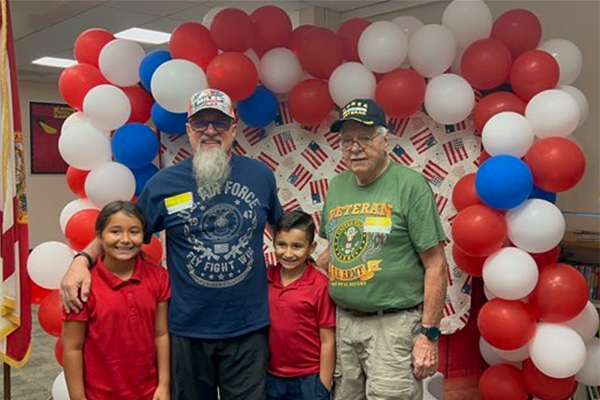 M. K. Rawlings Elementary honored their Veterans with a ceremony, certificates and song.