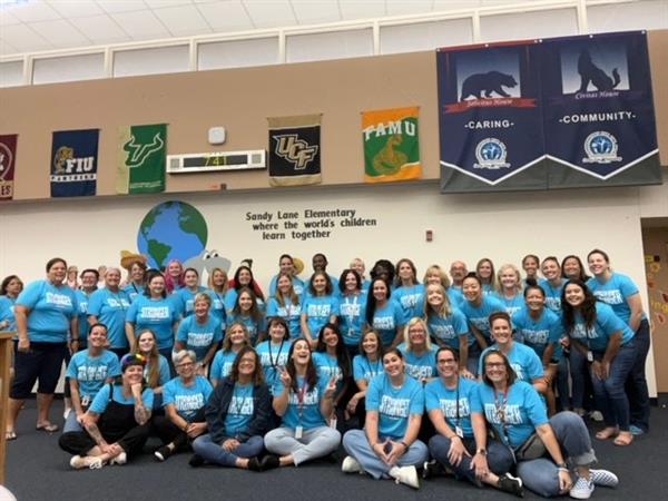 Sandy Lane Elementary staff ready to launch the 2022/23 school year, wearing their “Stronger Together” shirts. Connectedness is a strongly emphasized core value because it takes all of us working together to accelerate our scholars.