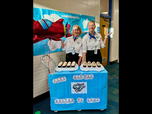 During Teacher Appreciation week, San Jose Elementary administrators dressed as Flight Attendants Wignall and Brown to proved in flight snack service on Hawk Flight #0502 to all Diamond Medallion members.