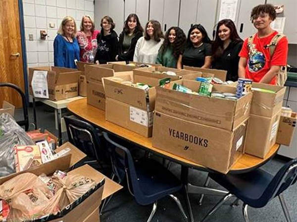 The Spanish Honor Society at East Lake High School collected over 2000 canned and non-perishable food items for the Hispanic Outreach Center in Clearwater.