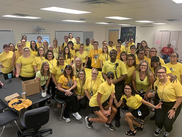 Bay Point Elementary staff dressed in yellow to honor and celebrate SSO of the Year- Archange Leveille aka “Office Paul”.