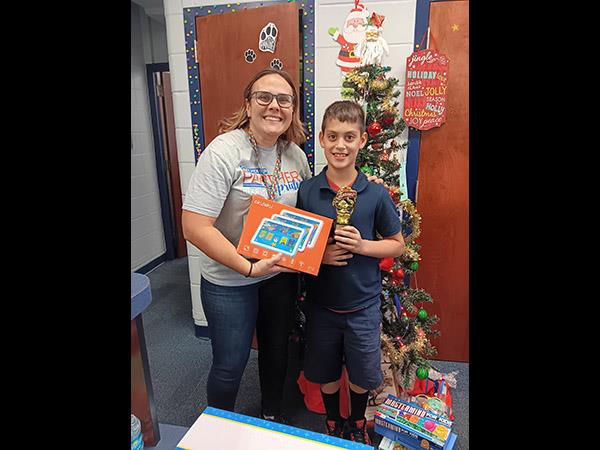 Ponce de Leon Elementary 3rd grade student, Alex Rodriguez (with Mrs. Ohmer) was the Myon reading challenge winner.