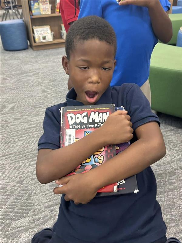 2nd Grader Enjoying the Midtown Academy Library