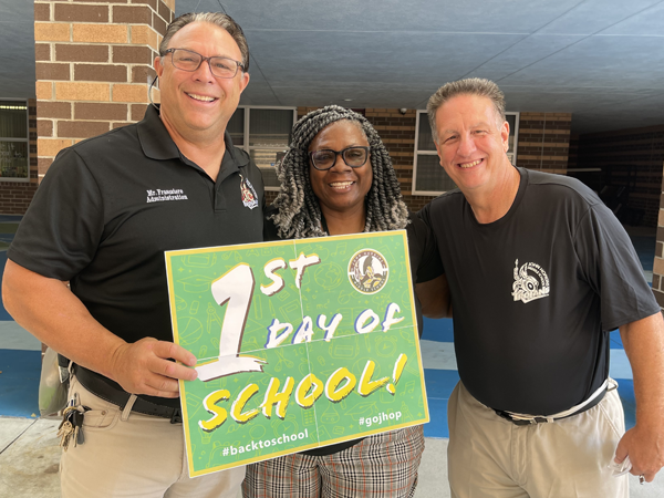 John Hopkins Middle staff welcome back students on the first day of school.