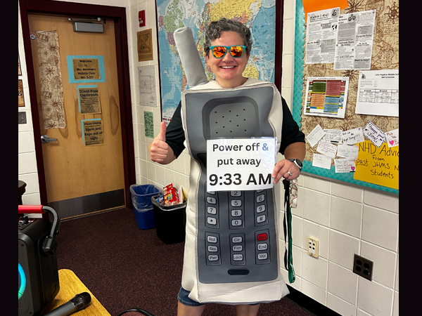Mrs. Kat Gardner, math teacher at John Hopkins Middle, dressed up as a cell phone on the 1st day of school to emphasize the new cell phone policy!