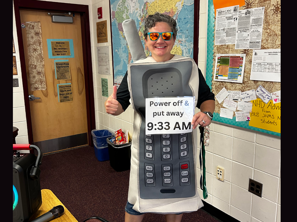 Mrs. Kat Gardner, math teacher at John Hopkins Middle, dressed up as a cell phone on the 1st day of school to emphasize the new cell phone policy! 