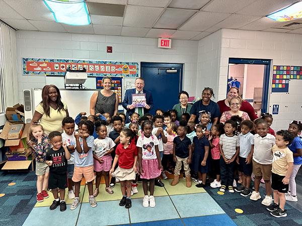 Superintendent Mr. Hendrick read The World Needs More Purple Schools to Fairmount Park Elementary PK3 & VPK classes.