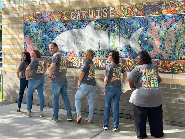 The Carwise Elementary front office crew love their jobs and they have the shirts to prove it.