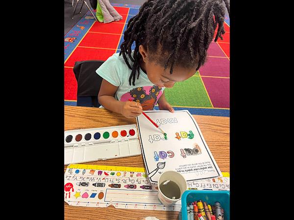 Learning and art collide in the best way by Painting CVC words at Perkins Elementary School.