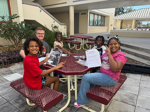 Perkins Elementary Band Director, Mr. Heller, is pulling small groups to support students in reading.