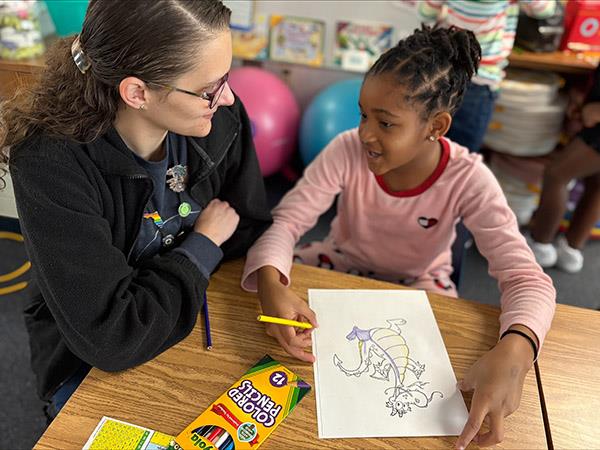 Perkins Elementary school counselor, Mrs. Stickles spends time working with a student.