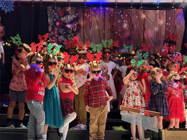 Shore Acres Elementary music teacher Mrs. Marr put on a fantastic Holiday Show with glowing drumsticks and props, and even snow!