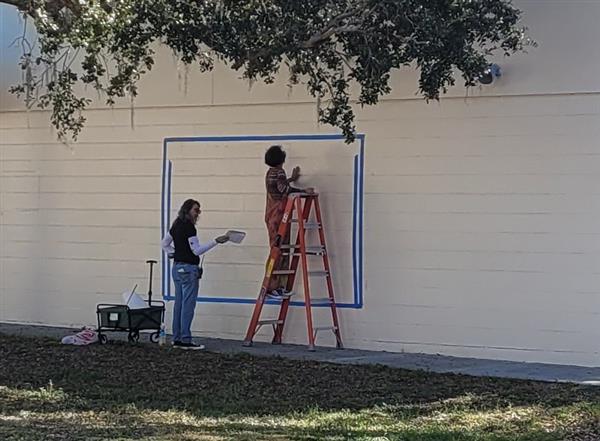 Ms. Pinney and Ms. Ballenger beginning our new mural