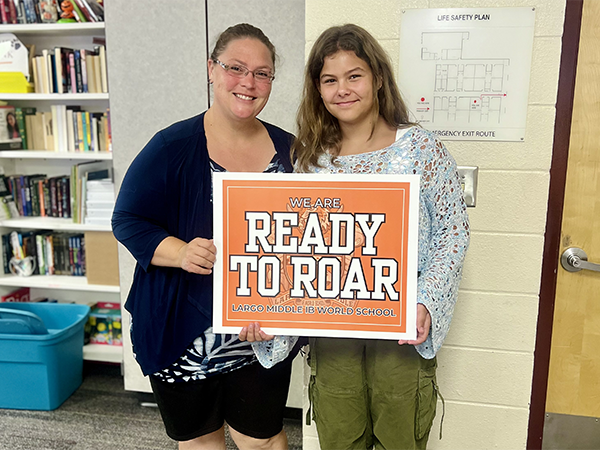 Student and teacher on the first day of school.